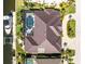 Aerial view of waterfront home featuring screened pool, boat dock and manicured landscaping at 3657 Aruba Ct, Punta Gorda, FL 33950