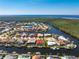 High-angle aerial view of canal-front homes in a residential neighborhood near the coast at 3657 Aruba Ct, Punta Gorda, FL 33950