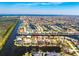 Aerial view of a waterfront community with numerous canals and single-Gathering homes at 3657 Aruba Ct, Punta Gorda, FL 33950