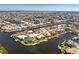 Aerial view of a waterfront community with canals and single-Gathering homes at 3657 Aruba Ct, Punta Gorda, FL 33950