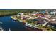 Waterfront estate featuring a private boat dock and pool, with lush landscaping, offering a serene coastal lifestyle at 3657 Aruba Ct, Punta Gorda, FL 33950