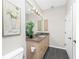 Bathroom featuring a granite countertop, updated lighting, and neutral paint at 3657 Aruba Ct, Punta Gorda, FL 33950