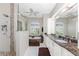 Elegant bathroom featuring a glass shower and soaking tub with natural light at 3657 Aruba Ct, Punta Gorda, FL 33950