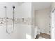 Modern bathroom featuring a tiled shower with pebble accents and a built-in niche at 3657 Aruba Ct, Punta Gorda, FL 33950