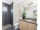Bathroom with a tile shower, vanity with granite countertop, and a neutral color scheme at 3657 Aruba Ct, Punta Gorda, FL 33950