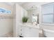Bright bathroom featuring a vanity, a toilet, and tiled shower with mosaic tile accents at 3657 Aruba Ct, Punta Gorda, FL 33950