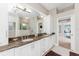 Spacious bathroom with double sink vanity, soaking tub, and glass-enclosed shower at 3657 Aruba Ct, Punta Gorda, FL 33950