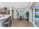 Breakfast nook and kitchen island with barstool seating that overlooks the backyard pool at 3657 Aruba Ct, Punta Gorda, FL 33950