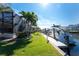This property features a private boat dock, lush landscaping, and screened lanai to enjoy the waterfront lifestyle at 3657 Aruba Ct, Punta Gorda, FL 33950