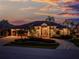 Beautiful home with lush landscaping and brick driveway at sunset at 3657 Aruba Ct, Punta Gorda, FL 33950