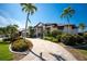 Beautiful single-Gathering home with a paver driveway, tropical landscaping, and a well-maintained front yard at 3657 Aruba Ct, Punta Gorda, FL 33950