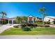 Charming single-Gathering home featuring a lush front yard, stone accents, and three-car garage at 3657 Aruba Ct, Punta Gorda, FL 33950