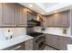 Kitchen showcases an island, stainless steel range and backsplash at 3657 Aruba Ct, Punta Gorda, FL 33950