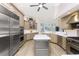 Gourmet kitchen features a center island, stainless appliances and custom cabinets at 3657 Aruba Ct, Punta Gorda, FL 33950