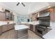 Spacious kitchen features custom cabinets, stainless appliances and a center island at 3657 Aruba Ct, Punta Gorda, FL 33950