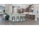 Kitchen with stainless steel barstools, countertops, and cabinets, with a decorative plant at 3657 Aruba Ct, Punta Gorda, FL 33950