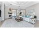 Inviting living room featuring a fireplace, tray ceilings, and an open layout at 3657 Aruba Ct, Punta Gorda, FL 33950
