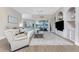 Spacious living room with sliding glass doors leading to the outdoor pool and patio area at 3657 Aruba Ct, Punta Gorda, FL 33950
