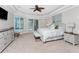 Spacious main bedroom with ceiling fan, and access to pool area at 3657 Aruba Ct, Punta Gorda, FL 33950