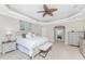 Comfortable and spacious main bedroom with large bed, ceiling fan, and plenty of room at 3657 Aruba Ct, Punta Gorda, FL 33950