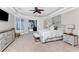 Main bedroom with ceiling fan, dressers and sliding glass door that leads to the pool at 3657 Aruba Ct, Punta Gorda, FL 33950