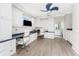 Spacious office with custom cabinetry, neutral walls, and a view into a private outdoor space at 3657 Aruba Ct, Punta Gorda, FL 33950