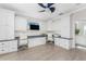 Large office space featuring custom built-ins, a ceiling fan, and wood-look flooring at 3657 Aruba Ct, Punta Gorda, FL 33950