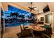 Enclosed lanai featuring a beautiful fire pit, summer kitchen, comfortable seating, and a pristine pool with views at 3657 Aruba Ct, Punta Gorda, FL 33950
