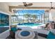 Outdoor seating area with a fire pit overlooking a pool and waterway view at 3657 Aruba Ct, Punta Gorda, FL 33950