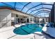 The spacious lanai features a gorgeous pool, spa, and seamless indoor/outdoor living at 3657 Aruba Ct, Punta Gorda, FL 33950