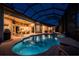 A stunning screened-in pool with spa and plenty of room for entertaining with views of the living room at 3657 Aruba Ct, Punta Gorda, FL 33950