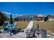 Backyard featuring dock, screened pool, outdoor bar, and well-maintained landscaping at 4238 Gardner Dr, Port Charlotte, FL 33952