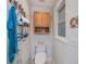 Small bathroom with toilet, vanity, towel rack, and window with natural light at 4238 Gardner Dr, Port Charlotte, FL 33952