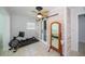 Exercise room with a sliding barn door and a ceiling fan at 4238 Gardner Dr, Port Charlotte, FL 33952