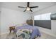 Cozy bedroom with tile flooring, ceiling fan, and dresser at 4238 Gardner Dr, Port Charlotte, FL 33952