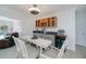 Bright dining area featuring a built-in bar, wine rack, and beverage cooler at 4238 Gardner Dr, Port Charlotte, FL 33952