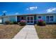 Charming single-story home with a screened porch, walkway, and well-maintained landscaping at 4238 Gardner Dr, Port Charlotte, FL 33952
