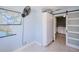 Hallway with storage cabinets and view of laundry room with sliding barn door at 4238 Gardner Dr, Port Charlotte, FL 33952