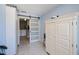 Hallway with white storage cabinet and sliding barn door to laundry room at 4238 Gardner Dr, Port Charlotte, FL 33952