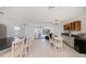 Spacious, well-lit kitchen opens to the living area and features a breakfast bar and tile flooring at 4238 Gardner Dr, Port Charlotte, FL 33952