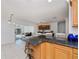 Spacious kitchen with granite countertops, a breakfast bar and view to other rooms at 4238 Gardner Dr, Port Charlotte, FL 33952