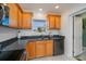 Lovely kitchen with granite countertops, wood cabinets and stainless steel dishwasher at 4238 Gardner Dr, Port Charlotte, FL 33952