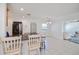 Open kitchen with stainless steel appliances, granite countertops, and breakfast bar at 4238 Gardner Dr, Port Charlotte, FL 33952