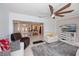 Inviting open-concept living space leading to the kitchen, featuring tile floors and plenty of natural light at 4238 Gardner Dr, Port Charlotte, FL 33952