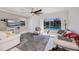 Comfortable living room with a view of the pool and outdoor area through sliding glass doors at 4238 Gardner Dr, Port Charlotte, FL 33952