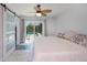 Main bedroom with sliding glass doors that offer access and view to pool at 4238 Gardner Dr, Port Charlotte, FL 33952