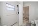 Shower stall with unique tiling and a view of the front door at 4238 Gardner Dr, Port Charlotte, FL 33952