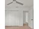 Bedroom featuring wood-look floors, fresh white walls, and large closet space at 4477 Shady Ln, Punta Gorda, FL 33980