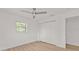 Bright bedroom features new floors, ceiling fan, and double-door closet at 4477 Shady Ln, Punta Gorda, FL 33980