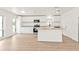 Spacious kitchen with ample natural light, white cabinets, stainless steel appliances, and a butcher block island at 4477 Shady Ln, Punta Gorda, FL 33980